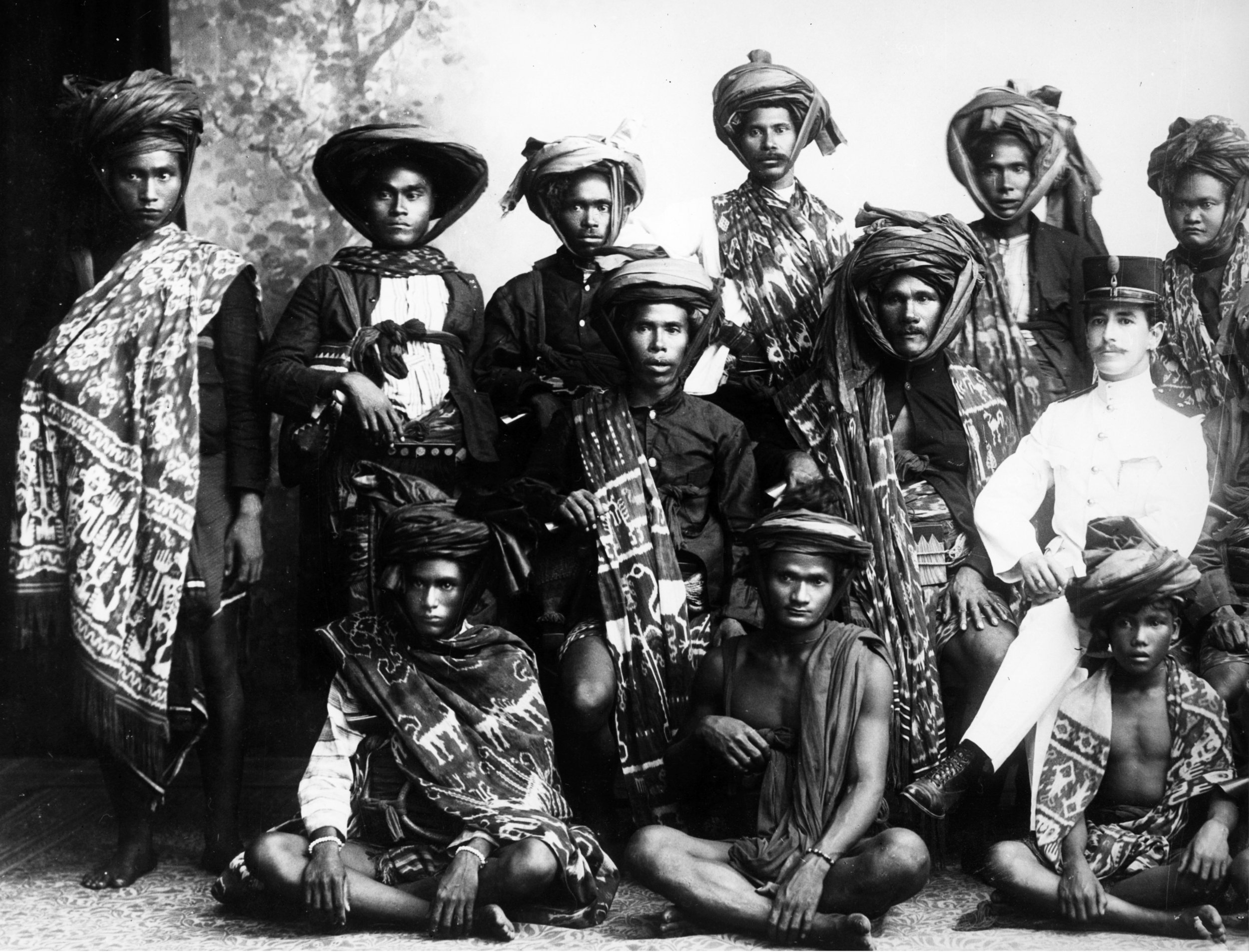 Group portrait of men in ikat shoulder cloths
